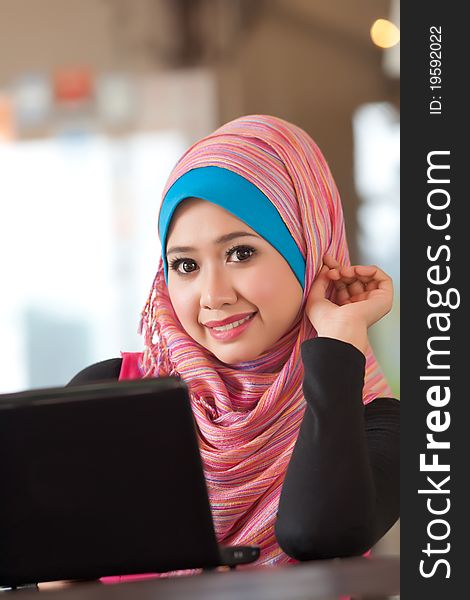 Portrait of the pretty muslim woman with the laptop. Portrait of the pretty muslim woman with the laptop