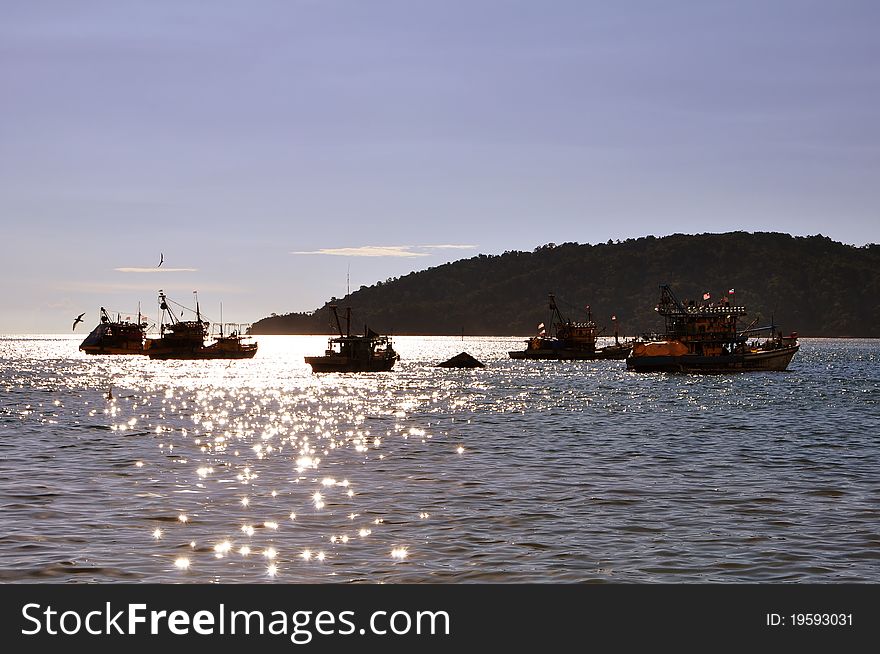 Late evening and a silhouette of fishing boats, at the seaside of Kota Kinabalu Sabah, Malaysia. Late evening and a silhouette of fishing boats, at the seaside of Kota Kinabalu Sabah, Malaysia