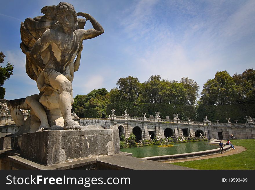 The garden, a typical example of the baroque extension of formal vistas, stretch for 120 ha, partly on hilly terrain. It is inspired by the park of Versailles, but it is commonly regarded as superior in beauty. The park starts from the back façade of the palace, flanking a long alley with artificial fountains and cascades. There is a botanical garden, called The English Garden, in the upper part designed in the 1780s by Carlo Vanvitelli and the London-trained plantsman-designer John Graefer, recommended to Sir William Hamilton by Sir Joseph Banks.[3] It is an early Continental example of an English garden in the svelte naturalistic taste of Capability Brown.
The fountains and cascades, each filling a vasca (basin), with architecture and hydraulics by Luigi Vanvitelli at intervals along a wide straight canal that runs to the horizon, rivalled those at Peterhof outside St. Petersburg. The garden, a typical example of the baroque extension of formal vistas, stretch for 120 ha, partly on hilly terrain. It is inspired by the park of Versailles, but it is commonly regarded as superior in beauty. The park starts from the back façade of the palace, flanking a long alley with artificial fountains and cascades. There is a botanical garden, called The English Garden, in the upper part designed in the 1780s by Carlo Vanvitelli and the London-trained plantsman-designer John Graefer, recommended to Sir William Hamilton by Sir Joseph Banks.[3] It is an early Continental example of an English garden in the svelte naturalistic taste of Capability Brown.
The fountains and cascades, each filling a vasca (basin), with architecture and hydraulics by Luigi Vanvitelli at intervals along a wide straight canal that runs to the horizon, rivalled those at Peterhof outside St. Petersburg.