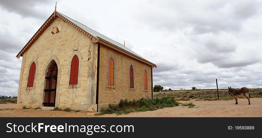 Abandoned church with visiting donkey in the outback ghost town of Silverton, New South Wales, Australia. Abandoned church with visiting donkey in the outback ghost town of Silverton, New South Wales, Australia.