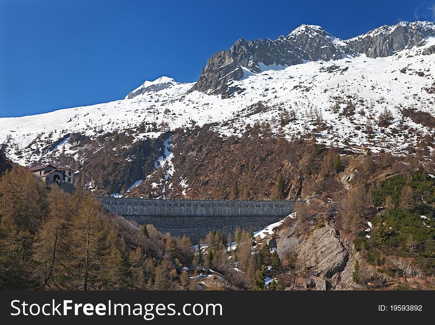Dam at the end of Arno man-made lake basin at 1900 meters on the sea-level. Brixia province, Lombardy region, Italy