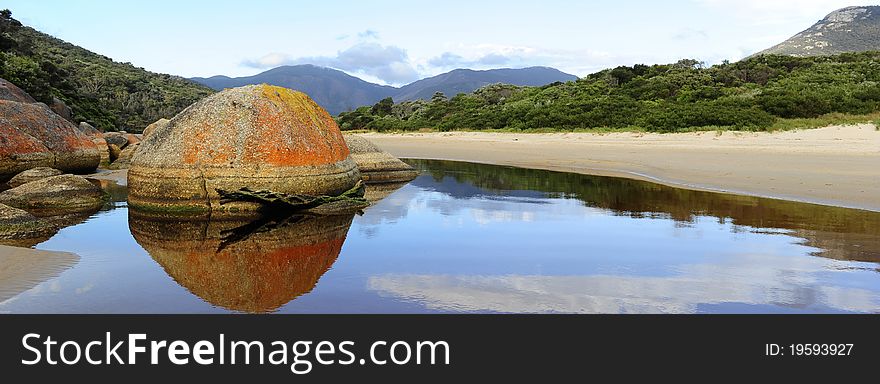 Tranquil and peaceful scene at river with mountain range in the background in Wilsons Promontory National Park, Victoria, Australia. Tranquil and peaceful scene at river with mountain range in the background in Wilsons Promontory National Park, Victoria, Australia.