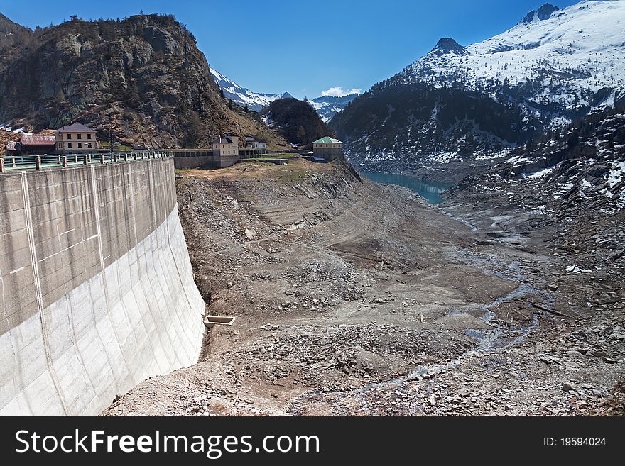 Dam at the end of Arno man-made lake basin at 1900 meters on the sea-level. Brixia province, Lombardy region, Italy