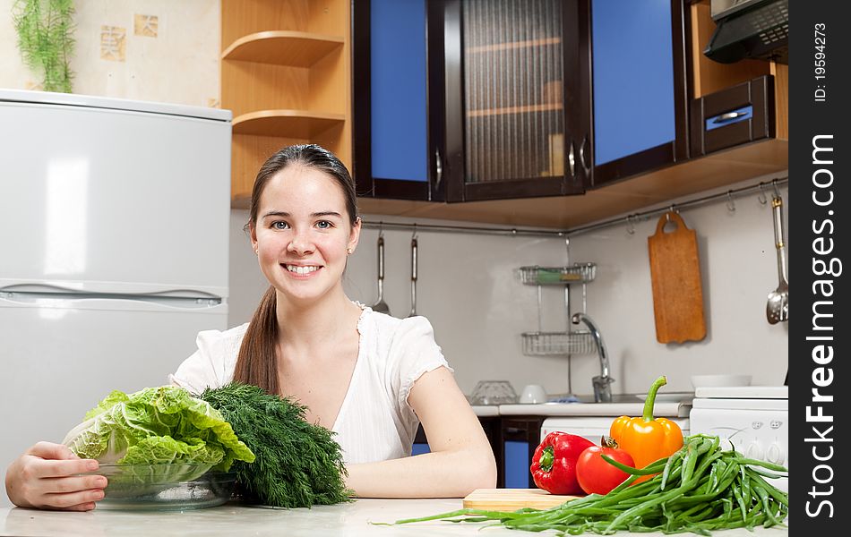 Young Beautiful Caucasian Woman In The Kitchen