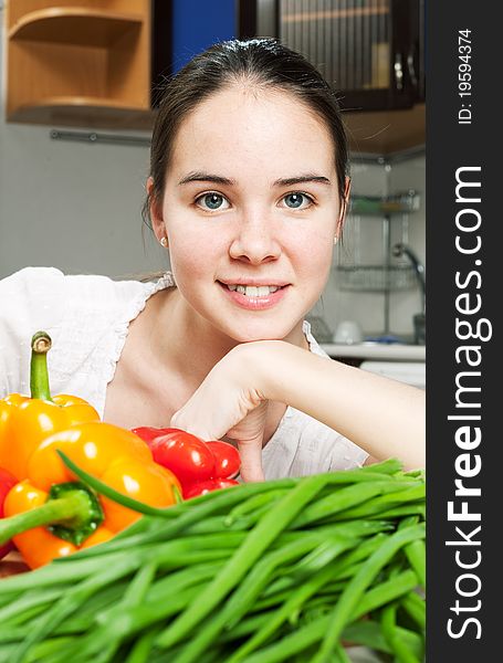 Young beautiful caucasian woman in the kitchen