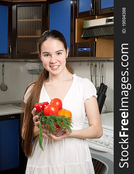 Young beautiful caucasian woman in the kitchen