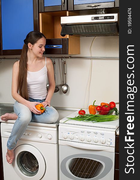 Young beautiful caucasian woman in the kitchen