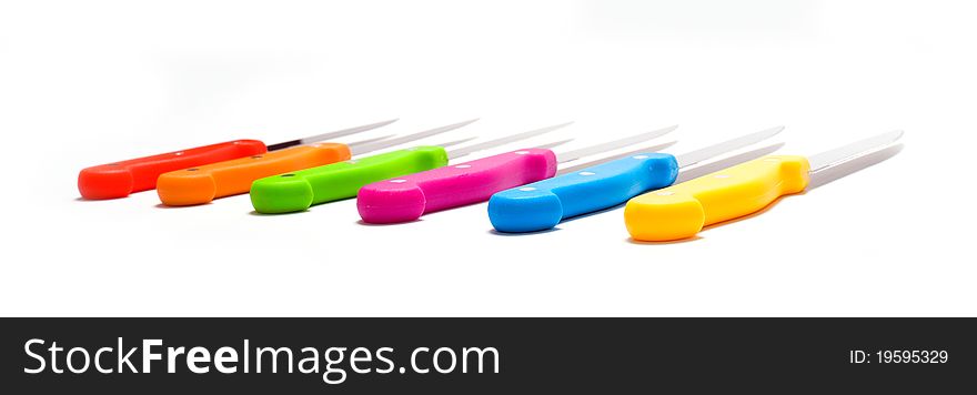 Set of colored knifes on white