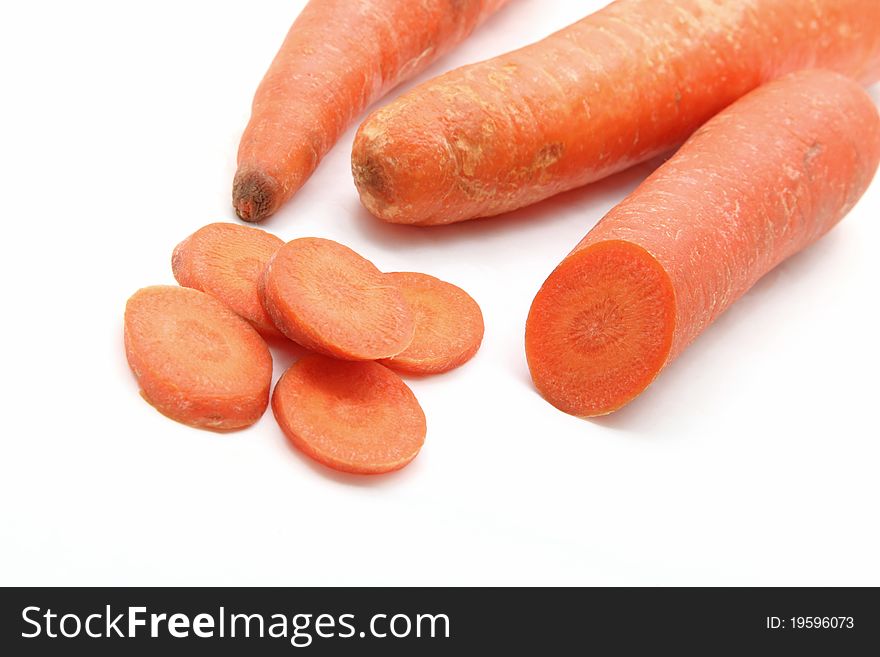 Studio shot of organic carrot slice isolated on white background, closeup. Studio shot of organic carrot slice isolated on white background, closeup