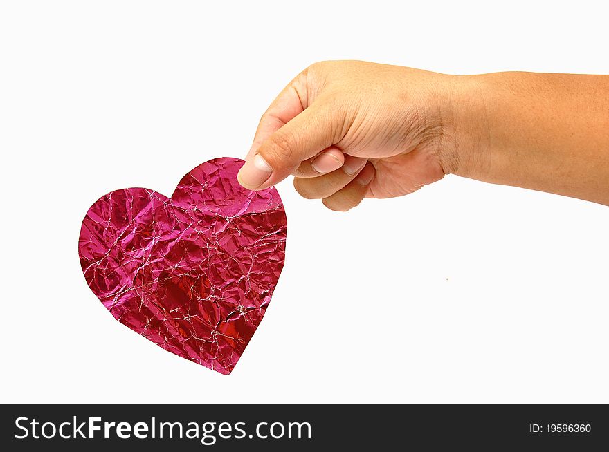 Red heart in hand isolated on white