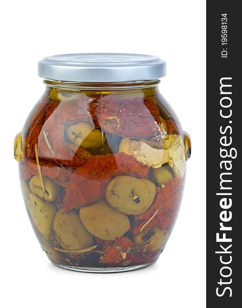 Green greek olives conserved with dried tomato and cheese in the glass jar  isolated on the white background. Green greek olives conserved with dried tomato and cheese in the glass jar  isolated on the white background