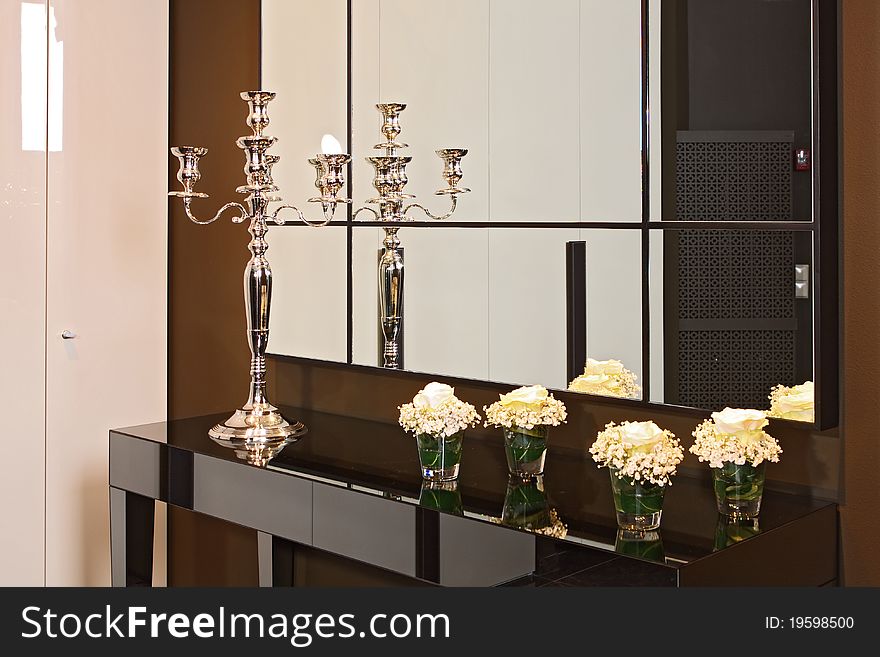 Spacious modern lobby with the big mirror and a bench from a skin