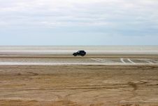 Driving  Jeep On A Beach Royalty Free Stock Photography