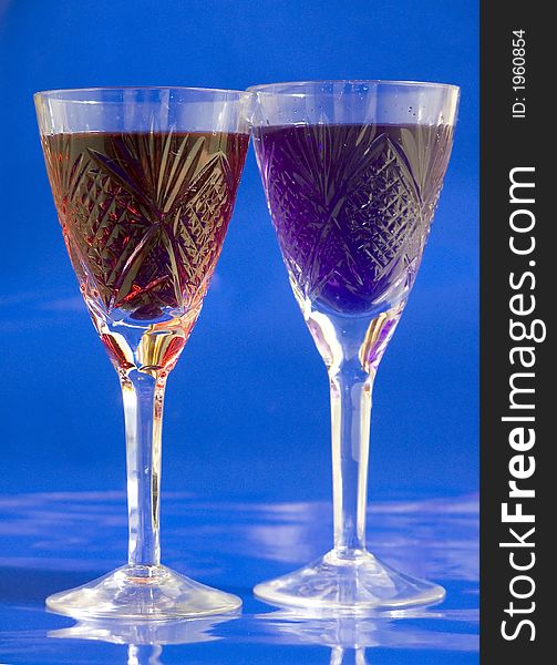 Tall glass with blue drink on white background. Tall glass with blue drink on white background