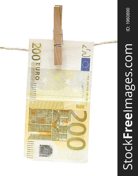 Yellow two hundred euro bill hanging on a clothesline. Isolated on a white background. Yellow two hundred euro bill hanging on a clothesline. Isolated on a white background.
