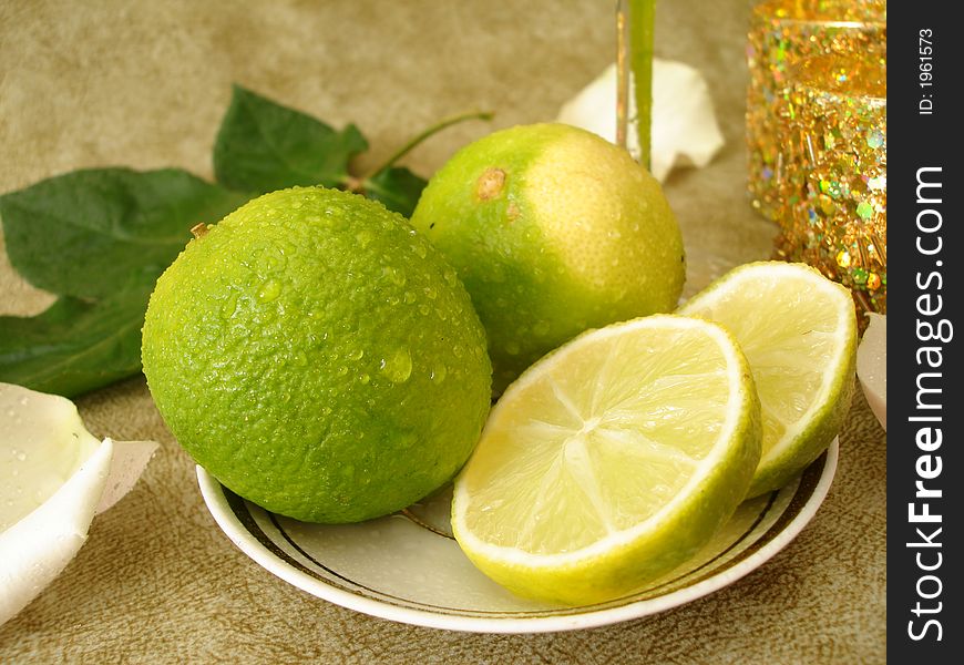 Green limes on a plate