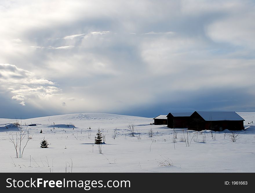 Three little house on a snowy hill, winter background. Three little house on a snowy hill, winter background