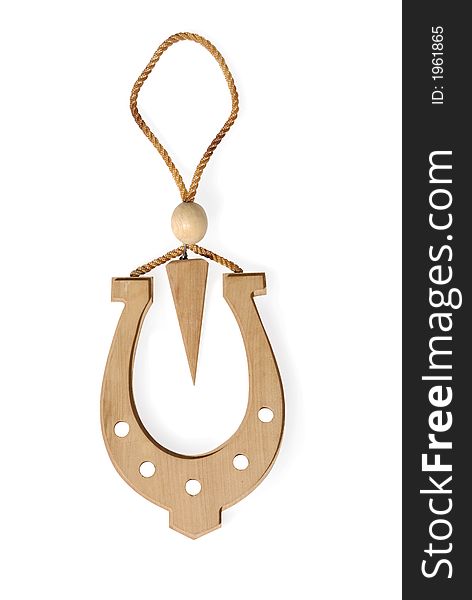 Wooden horseshoe and arrow with clipping path isolated over white background. Wooden horseshoe and arrow with clipping path isolated over white background