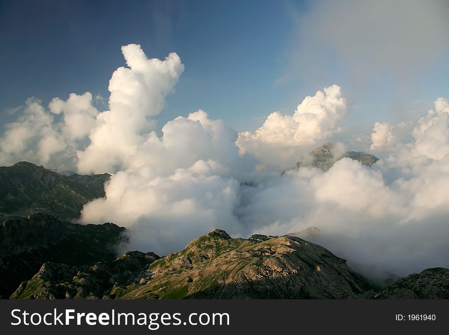 Clouds under mountains