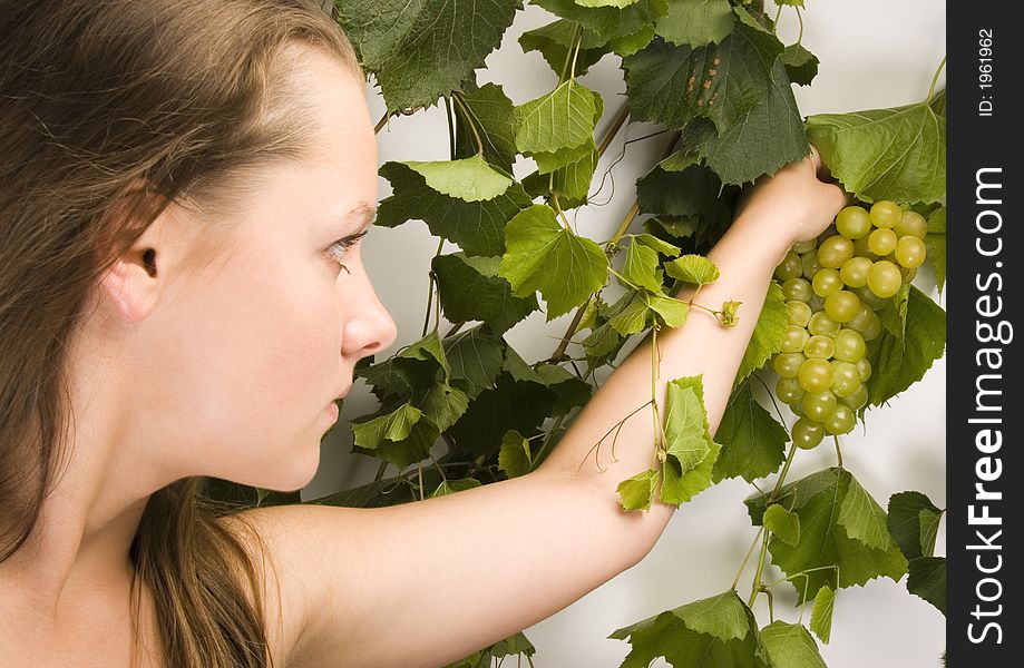 Beautiful young woman portrait with green grape. Beautiful young woman portrait with green grape