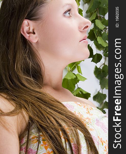 Beautiful young woman portrait with leaf