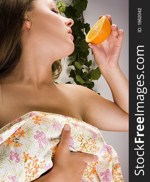 Beautiful young woman portrait with orange