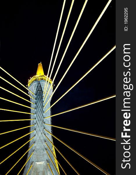 Detail of suspension bridge at night in Bangkok, Thailand