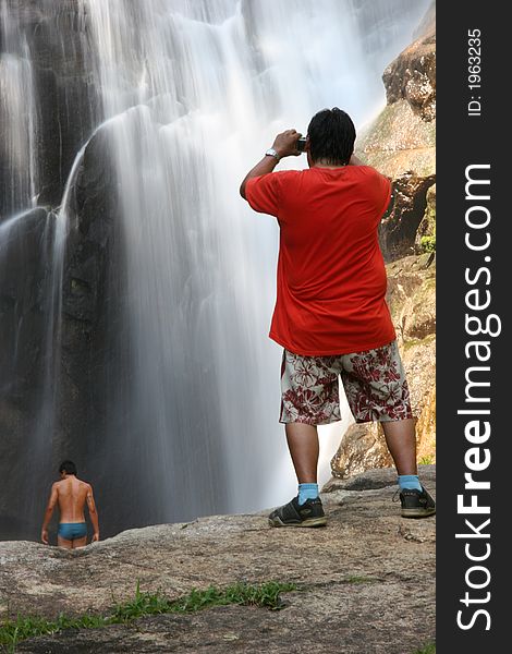 Person taking a pic of he waterfall