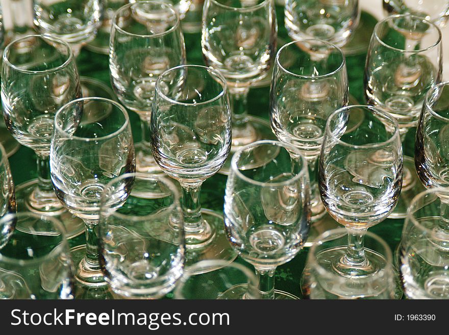 Wine glasses on green table