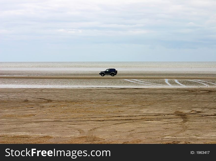 Driving  jeep on a beach