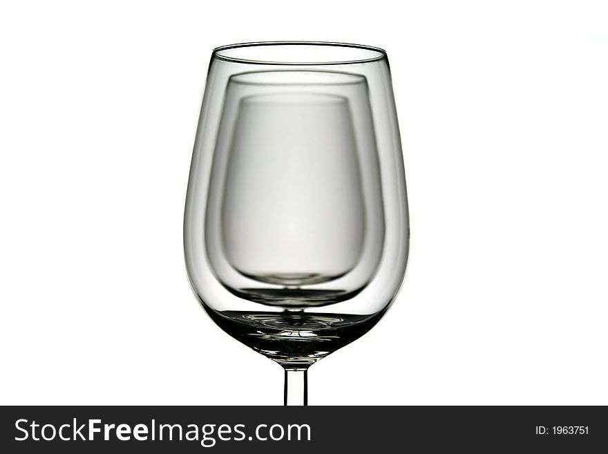 Wine glasses on the white background one after the other