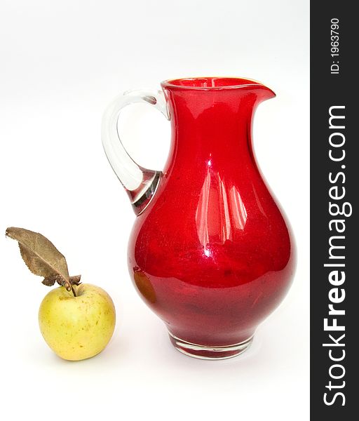Green apple and red jug. Green apple and red jug
