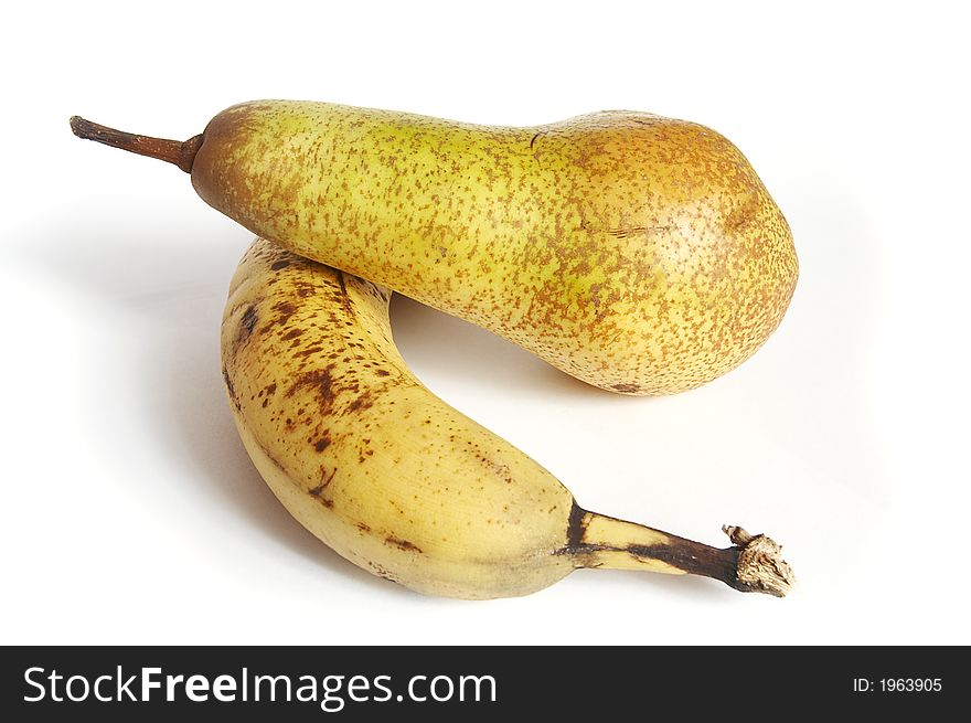 Fruits on the white background (banana and pear)
