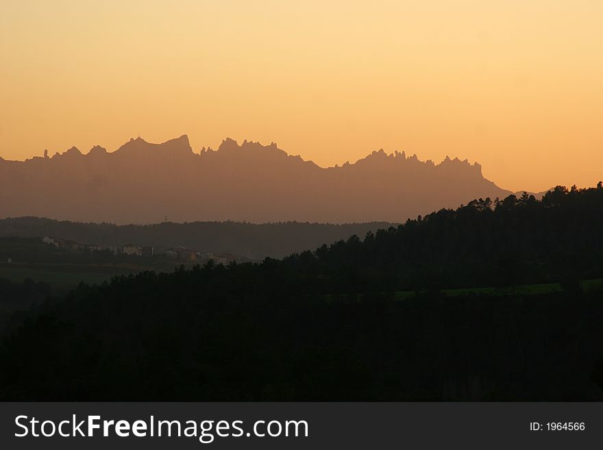 Mountain ridge near Narcelona, Spain, with red sunset sky. Mountain ridge near Narcelona, Spain, with red sunset sky