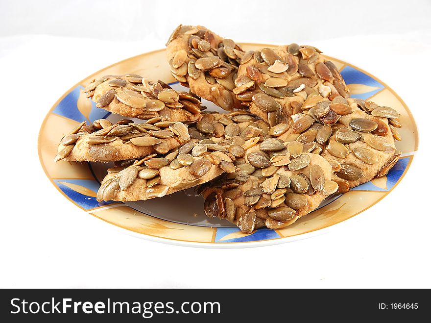 Cookies on a plate against white background