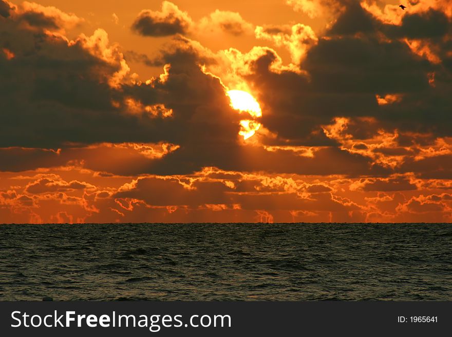 Gulf Coast sunset playing peak-a-boo with ciouds.Tampa Bay Florida