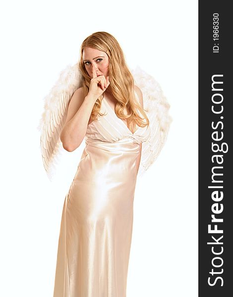 Isolated goddess angel with wing covering her mouth with her finger represent quiet time. Isolated goddess angel with wing covering her mouth with her finger represent quiet time