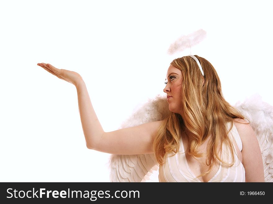 Isolated goddess angel with wing looking to side and holding up her hand. with copyspace on her hand. Isolated goddess angel with wing looking to side and holding up her hand. with copyspace on her hand