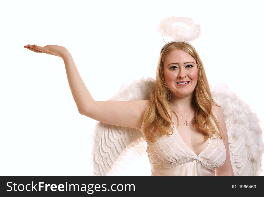 Isolated goddess angel with wing smiling and holding up her hand. with copyspace on her hand. Isolated goddess angel with wing smiling and holding up her hand. with copyspace on her hand