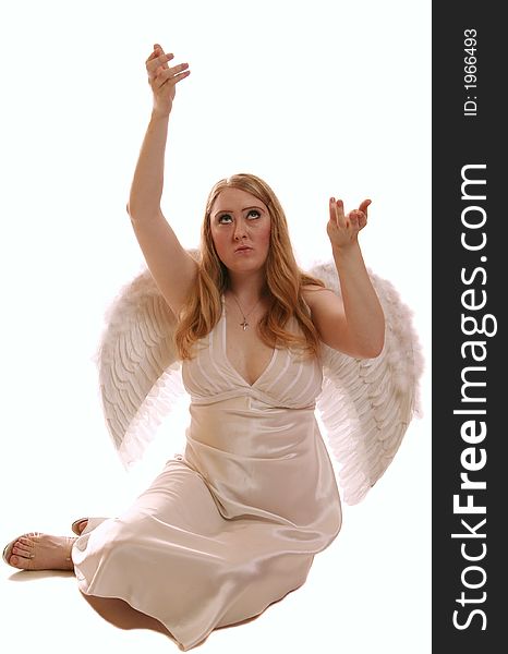 Isolated goddess angel with wing looking above offering to god with nice hand posing. Isolated goddess angel with wing looking above offering to god with nice hand posing