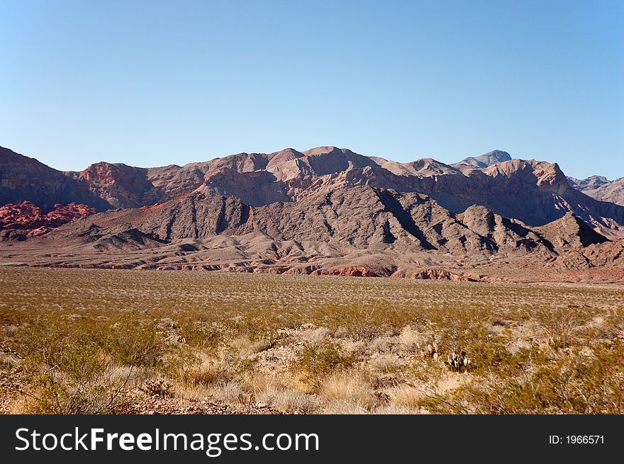 Desert landscape with mountains and blue sky