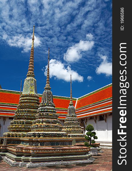 View of nice colorful triple pagoda in thai wat in Bangkok