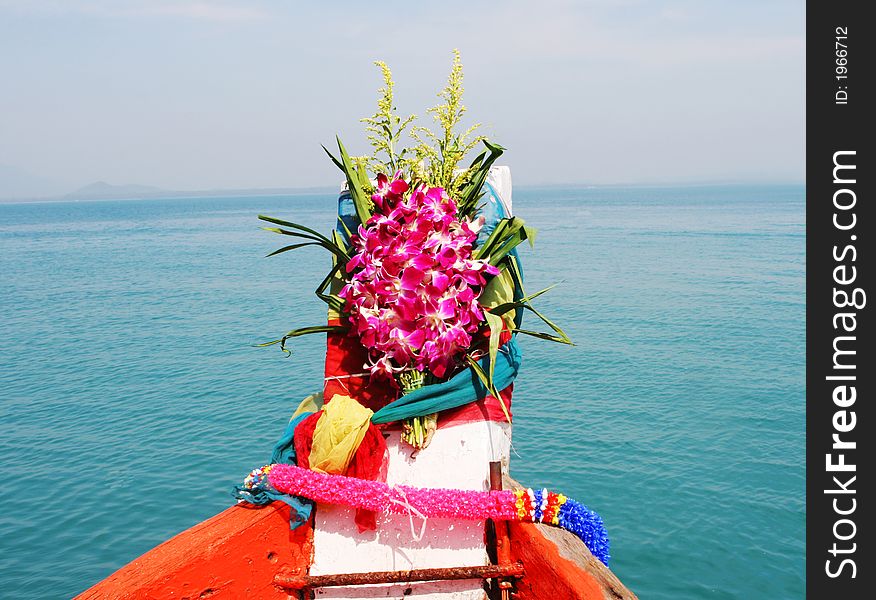 It is Thai tradition to put flowers on a boat for a safe journey - travel and tourism. It is Thai tradition to put flowers on a boat for a safe journey - travel and tourism