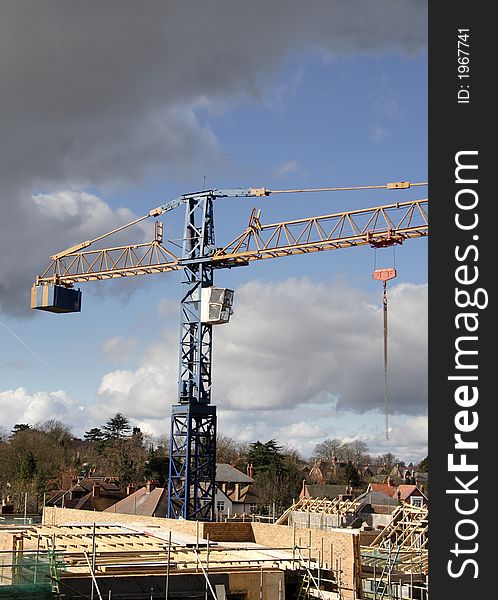 Crane on a Building Site Constructing an Apartment Block. Crane on a Building Site Constructing an Apartment Block