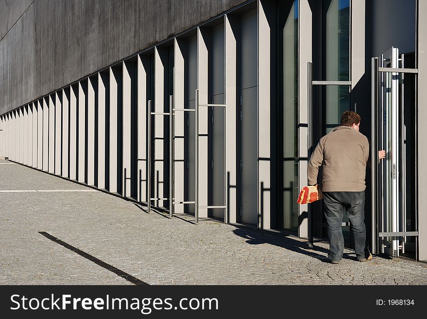 Man entering parking garage, Munich, Germany. Man entering parking garage, Munich, Germany