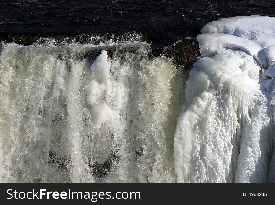 Winter waterfall with ice and snow