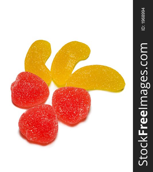 Close-up red and yellow sweets isolated on white. Close-up red and yellow sweets isolated on white.