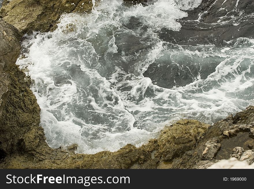 Sea Wave breaking on rocks. Sea Wave breaking on rocks