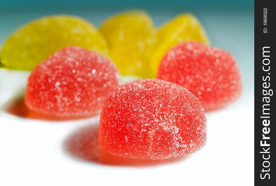 Close-up of sugared red and yellow sweets, shallow dof. Close-up of sugared red and yellow sweets, shallow dof