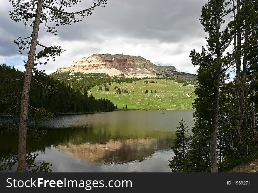 Sunlight shining on beautiful mountain over lake on Beartooth Highway Montana. Sunlight shining on beautiful mountain over lake on Beartooth Highway Montana